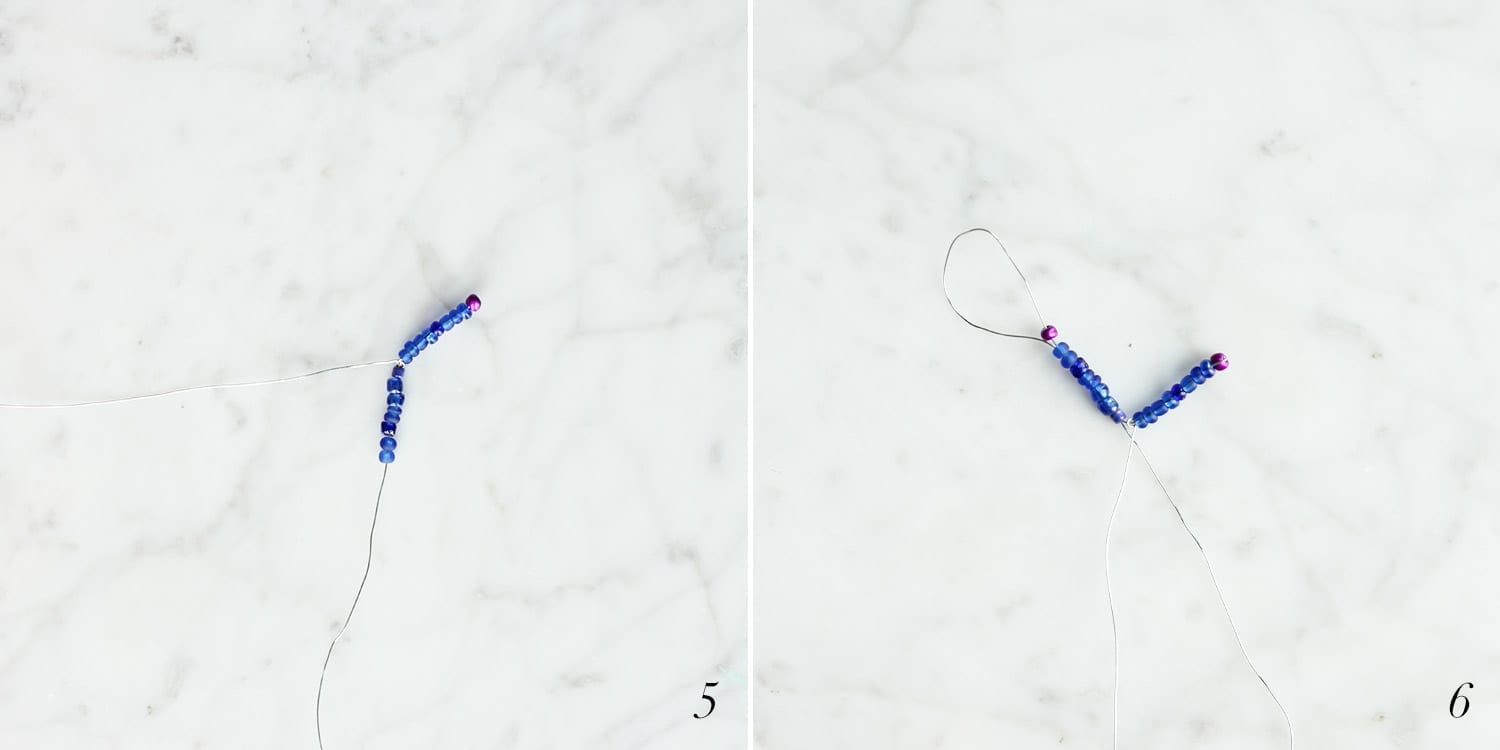 Blue and purple beads being strung to create a beaded flower with straight petals