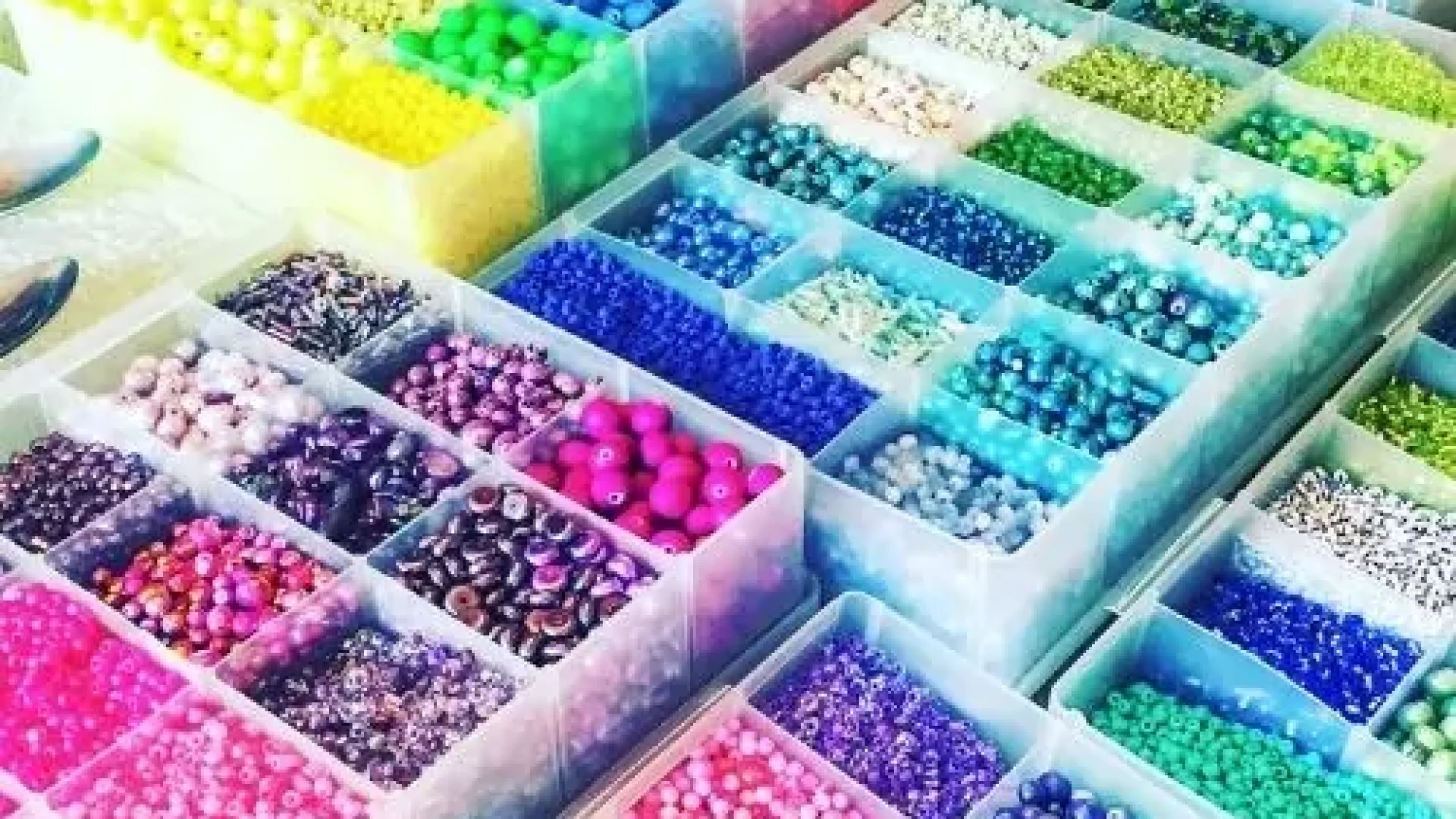 A Kids Jewelry Making Party - Bay Area full of colorful beads on a table.